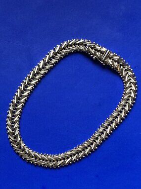 Gleaming woven look signed bracelet in sterling silver